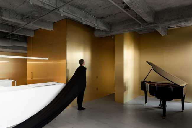 minimal apartment with brass walls